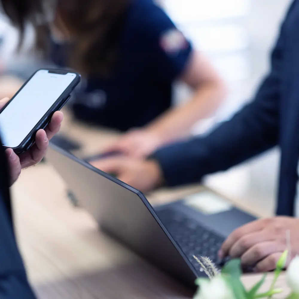 Business professionals using mobile app to manage warehouse intrusion detection and access control in real-time